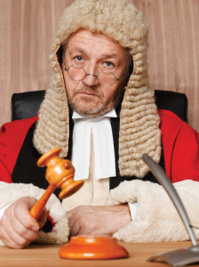 Judge holding gavel, portrait, close-up